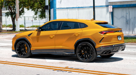 Miami Beach, Florida USA - April 15, 2021: 2019 Yellow Giallo Auge Lamborghini Urus, side viewのeditorial素材
