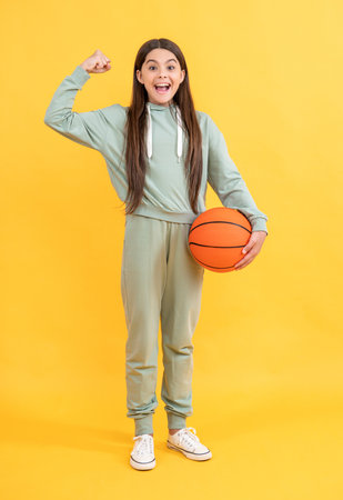 successful teen basketball girl in studio. teen basketball girl on background.の写真素材