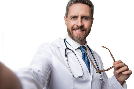 medical man do selfie on background. photo of medical man doctor. medical man isolated on whiteの写真素材