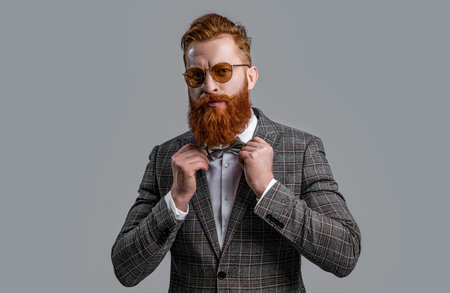 photo of charismatic tuxedo formal man with beard. tuxedo formal man isolated on grey.の写真素材