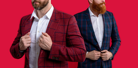 cropped image of stylish men in formalwear. stylish men isolated on red. stylish men at studio.の写真素材