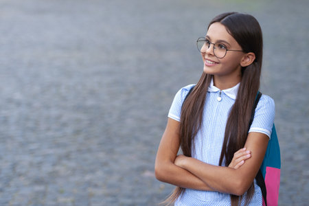 teenage school girl outdoor with copy space banner. photo of teenage school girl.