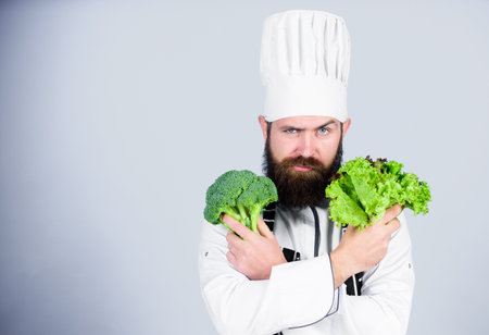 Vitamin. man use kitchenware. Professional chef in uniform. Healthy food and vegetarian. serious man cooking in kitchen. Dieting with organic food. Fresh vegetables. Health in his hands. copy spaceの写真素材