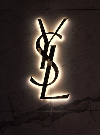 Miami, USA - March 20, 2021: lighted YSL logo trademark on shop wall at Design District in Florida