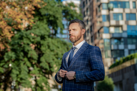 business executive on urban background. business executive wearing jacket in the street.の写真素材
