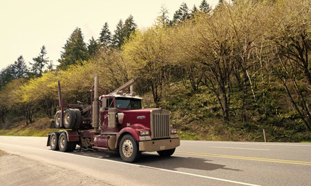 Oregon, USA - April 05, 2021: big kenworth hauler truck semi trailer for transporting on highway road.のeditorial素材