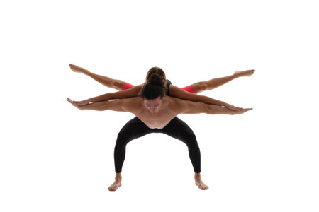 sport yoga couple isolated on white. sport yoga couple in studio. sport yoga coupleの写真素材