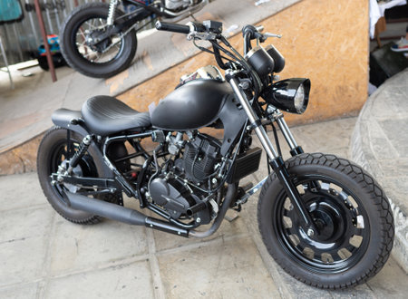 Classic black custombike custom bike motorcycle or bobber vehicle on display
