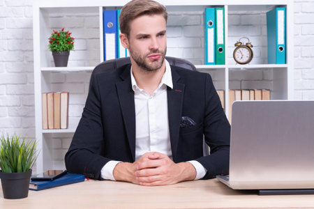 photo of corporate businessman in office wear jacket. successful businessman in officeの写真素材