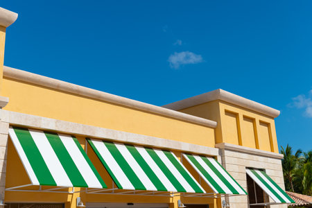 sunblind awning on the building. striped sunblind awning. sunblind awning on window.の写真素材