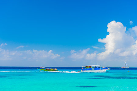 Grand Turk, Turks and Caicos - December 29, 2015: seaside seascape with boat in turquoise waterのeditorial素材