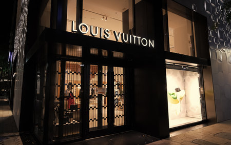 Miami, USA - March 20, 2021: Louis Vuitton name lit up over shopfront at design district in Florida