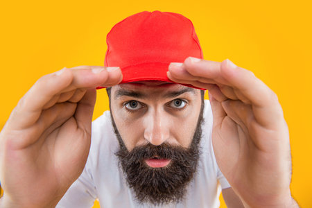 curious stylish caucasian man isolated on yellow. stylish caucasian man in studio.の写真素材