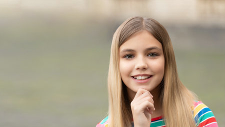 portrait photo of teen girl outside, copy space advertisement. portrait of teen girl.