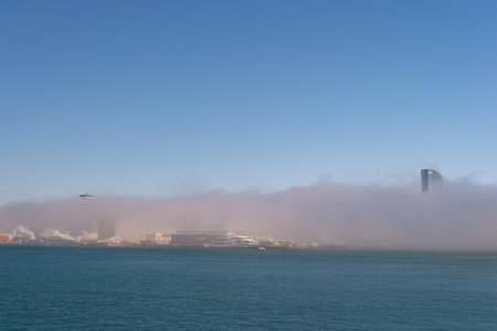 Barcelona, Spain - March 30, 2016: W barcelona hotel Vela building Barceloneta Beach in fogのeditorial素材