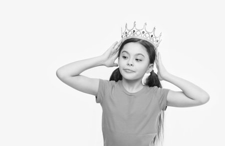 so pretty. we have a winner. real royal crown. she is prom queen. little beauty in princess crown. small girl egoist isolated on white. Source of pride. childhood happiness. jewel accessory shop.の写真素材