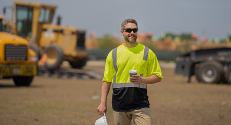 contractor man at construction site. contractor check building during break. male contractor at...