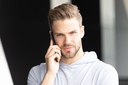 man talk smartphone outdoor. photo of man talk smartphone. man talk smartphone.