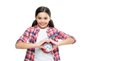 punctual teen girl with alarm clock, copy space. punctual teen girl with alarmの写真素材