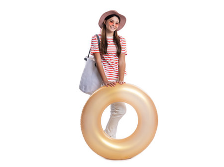 cheerful teen girl at summer holiday isolated on white. teen girl at summer holiday in studio.の写真素材