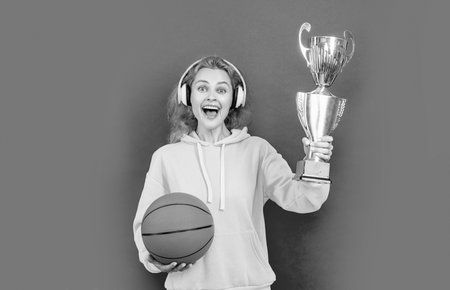 champion basketball woman player at studio. photo of basketball woman player with champion cup....