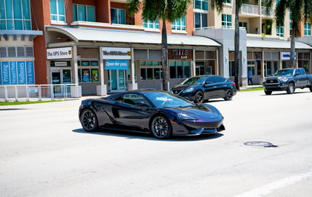 Miami Beach, Florida USA - April 15, 2021: mclaren 570GT MSO Black Collection, side corner view.のeditorial素材