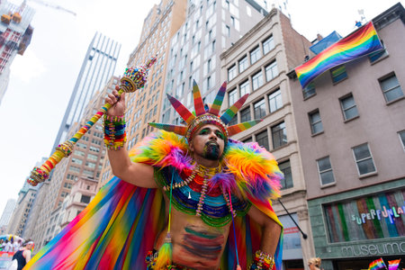 NEW YORK, NY, US - June 25, 2023: Pride march parade 2023 in New York. man gay with pride rainbow lgbtq flag peace. lgbt and lgbtq parade.のeditorial素材