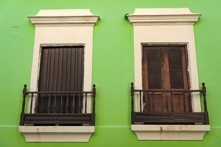 balcony railings on two windows. balcony railings outdoor. photo of balcony railings fence.の写真素材