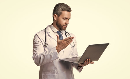 doctor presenting ehealth on background. photo of ehealth and doctor man with laptop.の写真素材