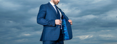 cropped view of man in suit outdoor. man in business suit. photo of man in suit. man in suitの写真素材