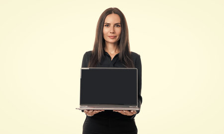 Young businesswoman freelancer ceo boss manager employee showing laptop screen with blank mockupの写真素材