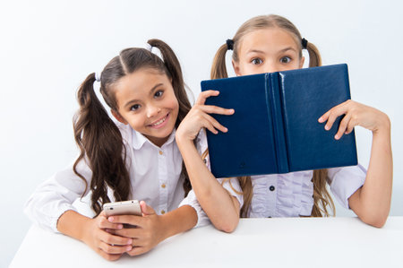 two girls study in school class. education and knowledge. children girls study with books. high...