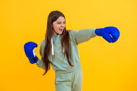 girl sport training. sport active wear. Teen boxer training with discipline. teen girl in boxing goves. boxing training of teen girl. girl learn punching. teen defense. practicing punchesの写真素材