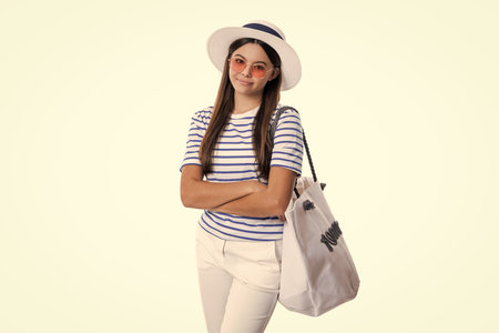 photo of summertime stylish smiling teen girl with beach bag. summertime stylish teen girlの写真素材