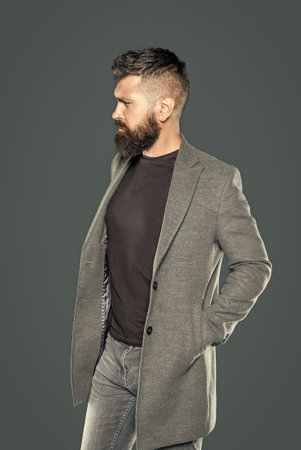 elegant bearded mature man wear casual on grey backgroundの写真素材