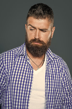 portrait of bearded man wear checkered shirt on grey backgroundの写真素材