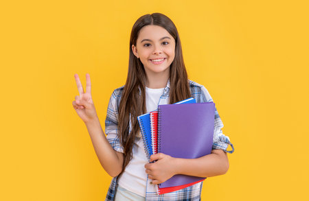 teen girl student hold workbooks. get knowledge since childhood. learning subjects in school. Girl childhood education. back to school. school education for teen girl. peace. School curriculumの写真素材
