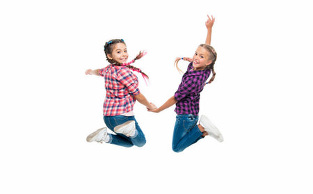 sisterhood and friendship of girls children friends having fun and jumping