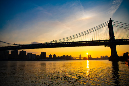 bridge connecting Lower Manhattan at Canal Street with Downtown Brooklyn. new york urban architecture. manhattan bridge in new york. architecture of historic bridge in manhattan. sunset in new yorkの写真素材