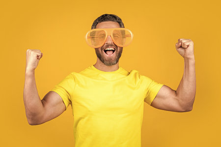 glad party man in summer glasses on background. party man in summer glasses in studio.の写真素材