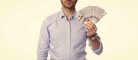 cropped view of man holding money banknotes studio isolated on white. Bank money for loansの写真素材