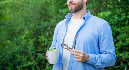 lifestyle of man with coffee, cropped view. lifestyle of man with coffee in the morning.の写真素材