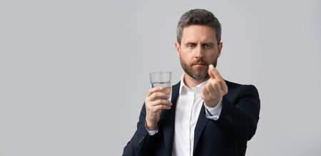 tired business man take painkiller. man ceo offer painkiller for a headache. stressed tired...