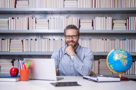 online private teaching. online classroom in school. online education in school classroom. school teacher in classroom. online education. teachers day. college teacher in class. Acquiring knowledgeの写真素材