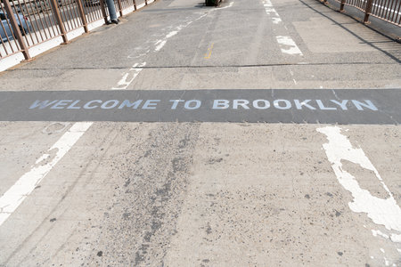 welcome brooklyn sign of brooklyn bridgeroad way to manhattan, new yorkの写真素材