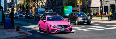 Chicago, USA - April 27, 2023: Unique pink color sedan Mercedes Benz on a crosswalk, corner viewのeditorial素材