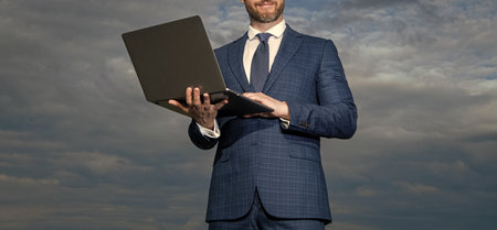 Businessman crop view working on business laptop. Business information technology