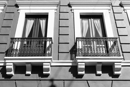 photo of balcony railings on windows. balcony railings on house. balcony railings facade.の写真素材
