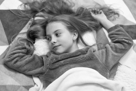childhood of teen girl relax in bed. childhood of teen girl relax in bedroom.の写真素材