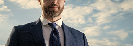 cropped photo of boss in suit. boss in suit on sky background. boss in suit outdoor.の写真素材